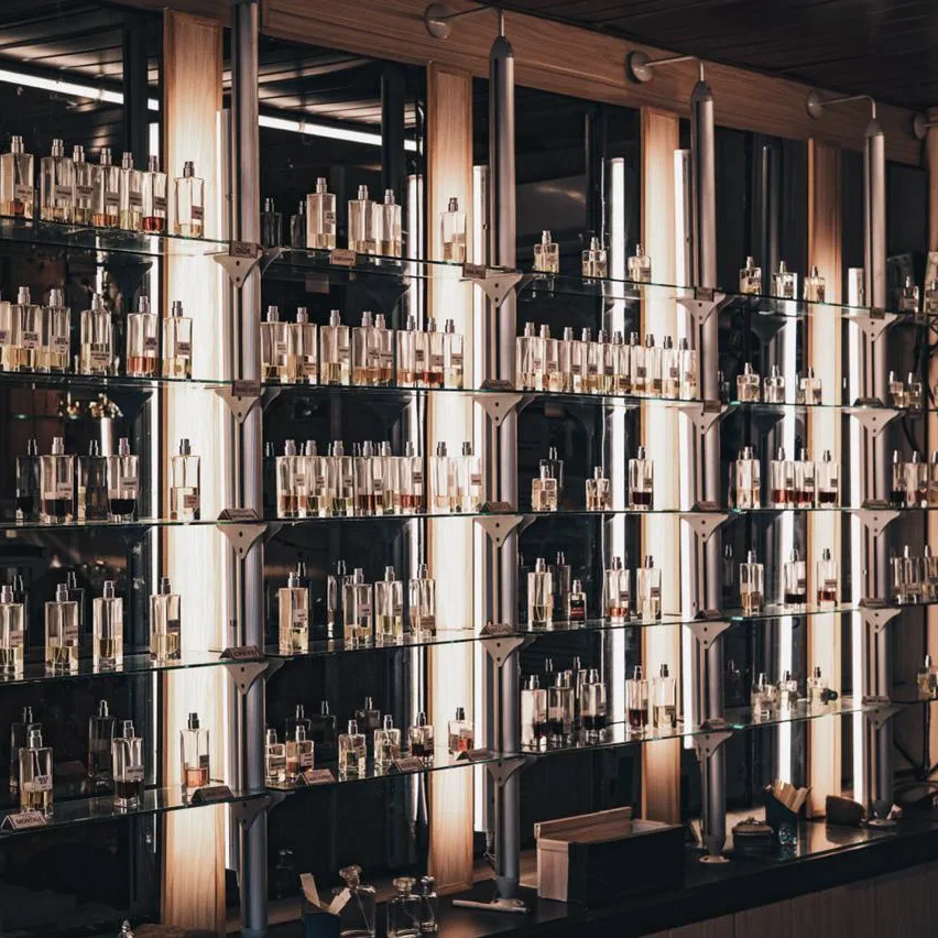 The studio's shelf wall in Colombo, lined with flacons